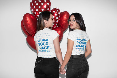 Mockup of a Romantic Couple Wearing a T-Shirt and Holding Hands 