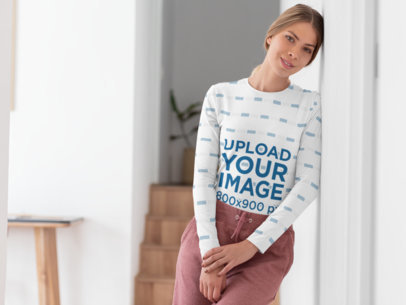 Sublimated Long Sleeve Tee Mockup Featuring a Woman at Home