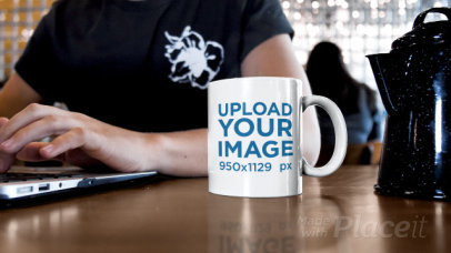 11 oz Coffee Mug Video Featuring a Man Working at a Cafe