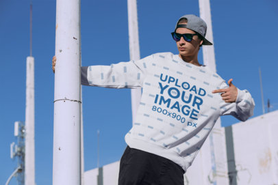 Sublimated Crewneck Sweatshirt Mockup Featuring a Man at an Urban Environment