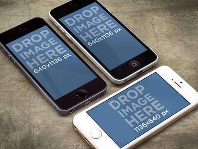 Mockup Featuring Three iPhones on a Concrete Table