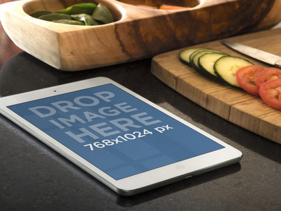 Mockup Featuring an iPad in Portrait Placed on a Kitchen Table