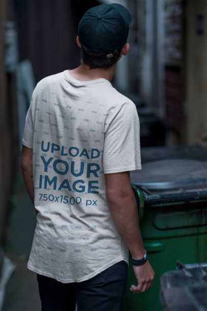 Back View T-Shirt Mockup Featuring a Man in an Alley