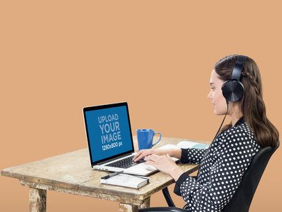 MacBook Pro Mockup of a Woman Listening to Music