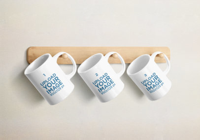 Mockup Featuring Three 11 Oz Coffee Mugs Hanging From a Wooden Rack 2374-el1