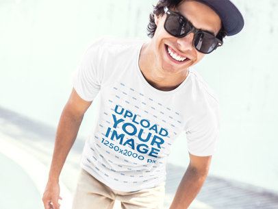 Mockup of a Guy Wearing a T-Shirt Smiling at a Skatepark