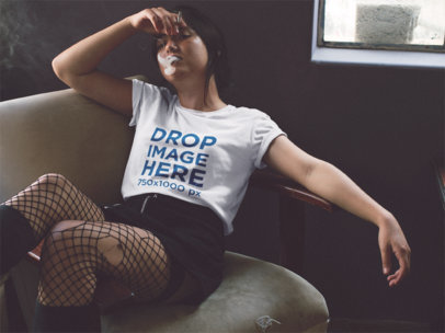 Tee Mockup of a Woman Smoking in a Dark Room a11666