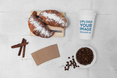 Mockup of a Coffee Cup Placed by Some Coffee Beans and Food
