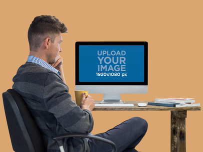 iMac Mockup Featuring a Young Man With His Coffee