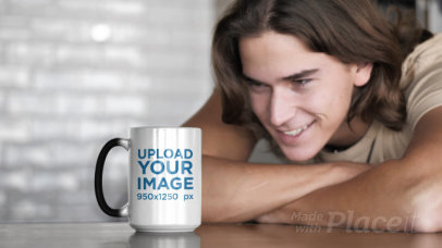 Video of a Man Watching a 15 oz Magic Mug Change Its Color 