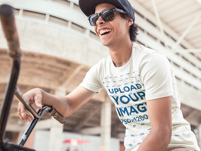 Urban BMX Rider Wearing a Cap and Tee Mockup a11590