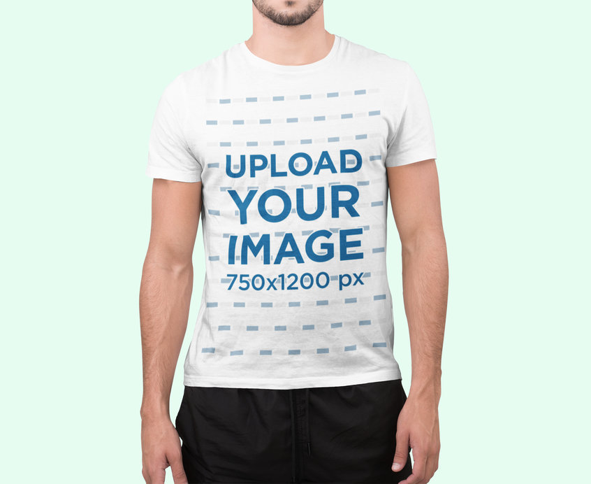 T-Shirt Mockup of a Man Standing at a Studio