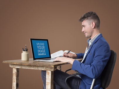 Man Working on His Macbook Mockup
