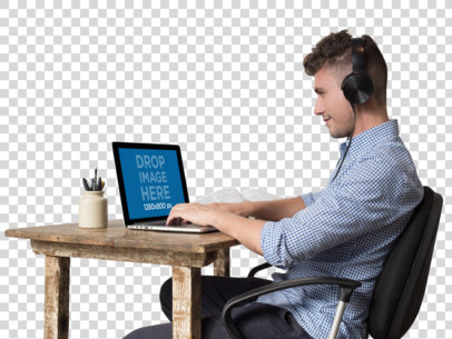 MacBook Mockup Featuring a Young Man Working and Listening to Music a11721