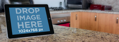 Mockup of a Black iPad on a Counter