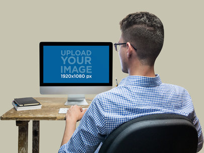 Mockup of a Man Working at His iMac 