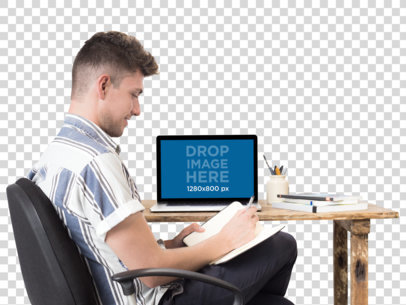 MacBook Mockup of a Man Writing in His Notebook