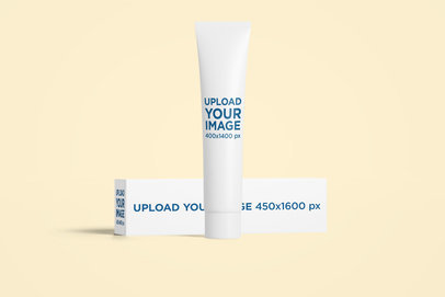 Mockup Featuring a Cosmetic Tube and Its Box Placed Against a Colored Backdrop