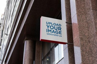 Mockup of a Squared Store Sign Placed on a Tiled Wall
