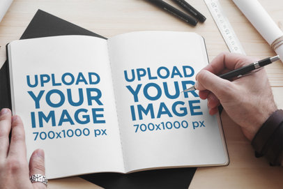 Sketchbook Mockup Featuring a Man Drawing 2341-el1