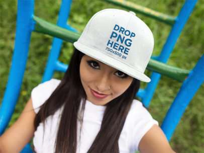 Hat Mockup Featuring a Smiling Hispanic Woman at a Park