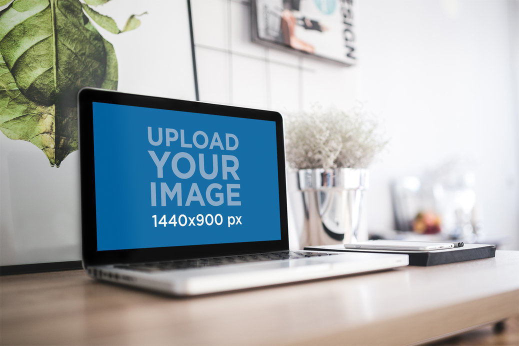 Mockup of a MacBook Pro Placed on a Modern Working Desk 