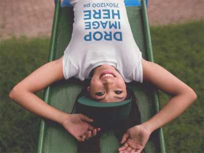 Smiling Girl Upside Down on a Slide T-Shirt Mockup a11737