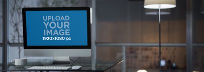 Mockup of an iMac at a Modern Corporate Office a11757