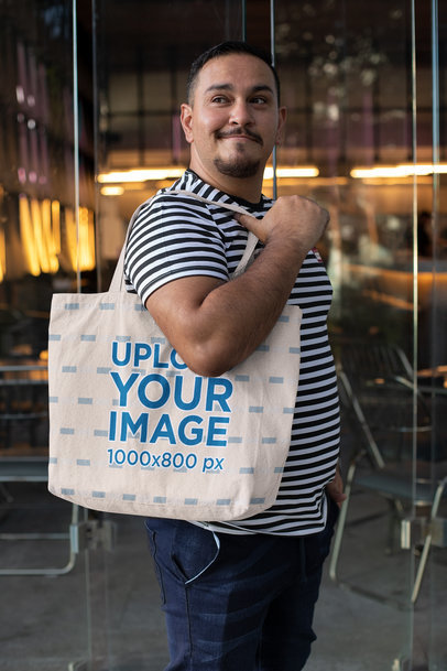 Tote Bag Mockup Featuring a Man Outside a Bar