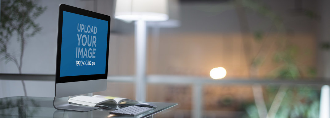 iMac Mockup on a Glass Desk in a Modern Office