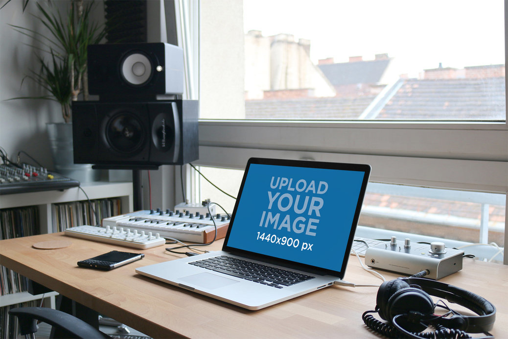 MacBook Mockup Featuring Audio Producing Equipment