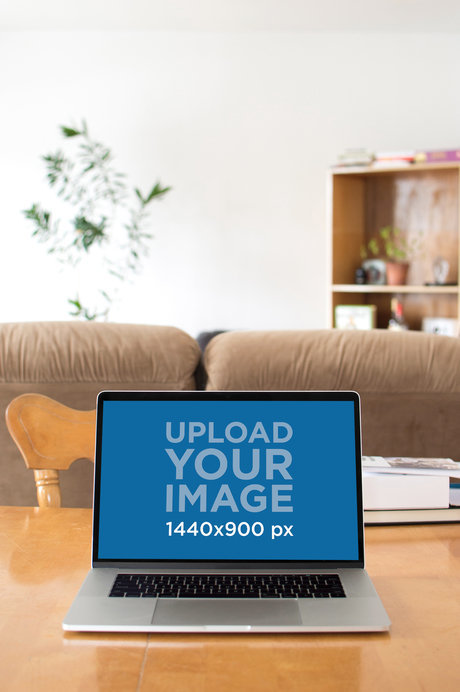Mockup of a MacBook Placed on a Tabletop at Home
