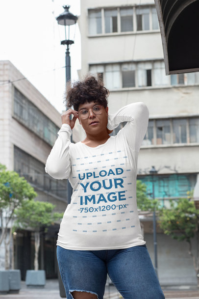 Plus Size Long Sleeve Tee Mockup of a Woman Posing on the Street