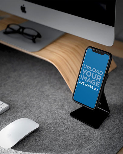 Mockup Featuring an iPhone 11 Pro Standing on a Desk