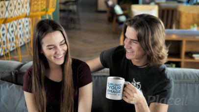 11 oz Mug Video Featuring a Happy Couple Sitting on a Couch  31583v