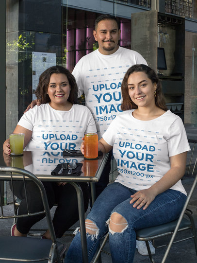 Plus Size T-Shirt Mockup Featuring Three Friends Having Drinks