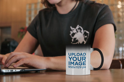 11 oz Magic Mug Mockup Featuring a Man Working