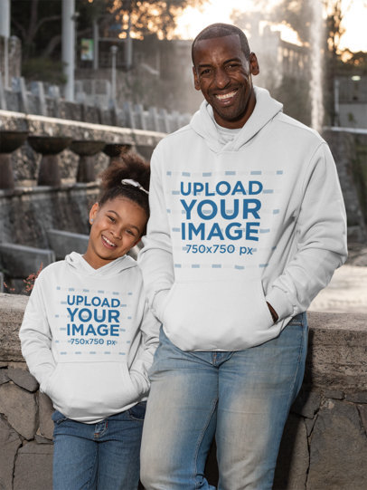 Mockup of a Dad and His Daughter Wearing Pullover Hoodies 