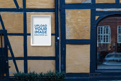 Poster Display Case Mockup Featuring a Worn Block-Style Wall