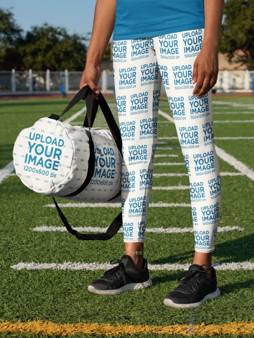 Duffle Bag Mockup Featuring a Woman Wearing Leggings