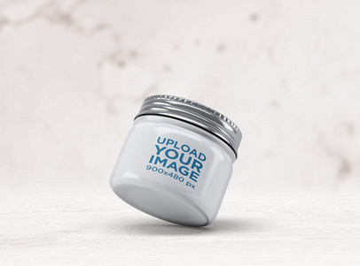 Mockup Featuring a Small Jar Placed against a Marble Background