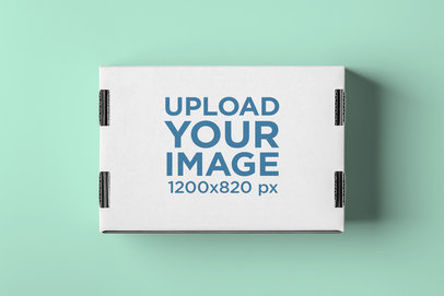 Top View Mockup of Cardboard Box on a Plain Surface