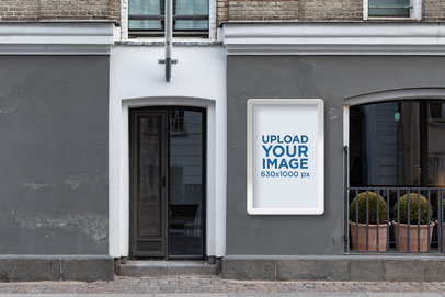 Poster Display Case Mockup Featuring a Vintage Building