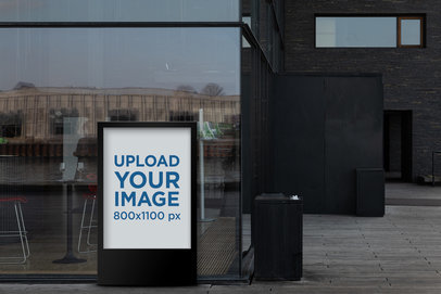 Mockup of a Mupi Next to a Modern Building 