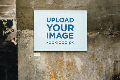 Mockup of a Horizontal Poster Frame on an Old Wall