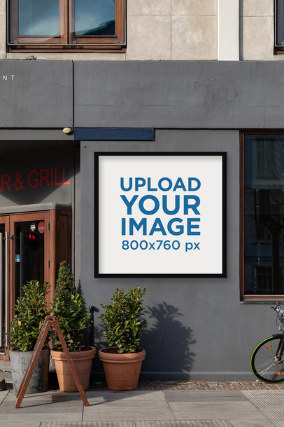 Mockup of a Poster Display Case Placed on a Restaurant Facade 2497-el1