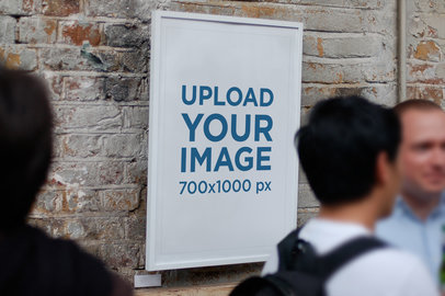 Poster Frame Mockup Featuring People Passing By