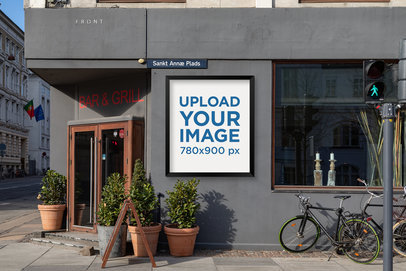 Mockup Featuring a Poster Display Case Placed Next to a Restaurant's Entrance