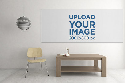 Art Print Mockup Featuring a Canvas Hanging over a Neat Wooden Table 