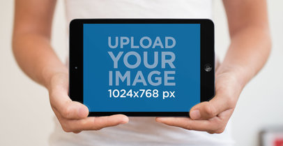 Wide Shot iPad Mini Mockup Held Showing the Front View a11789